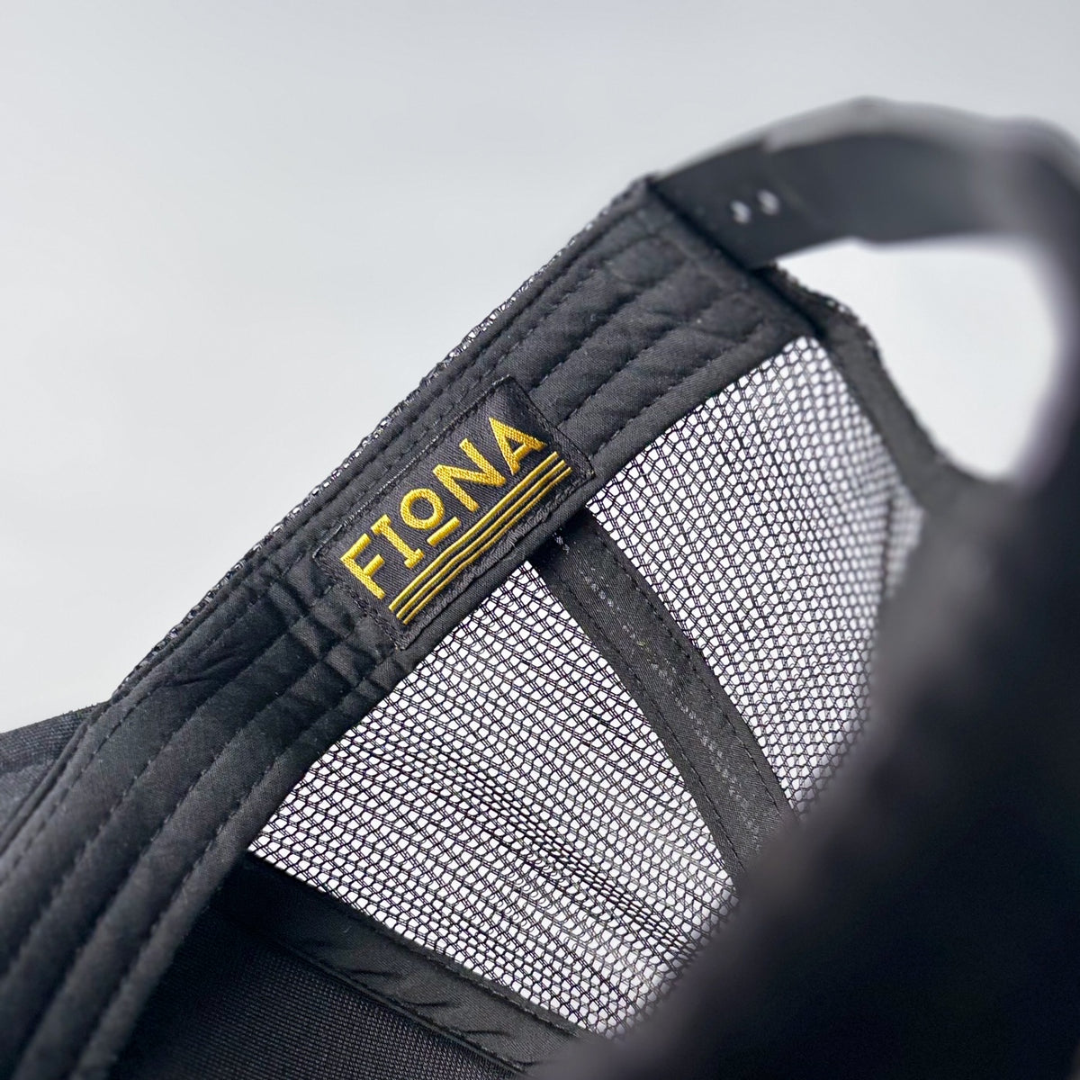 Fiona Trademark Trucker Hat - Black